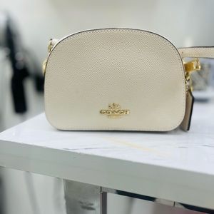 Is completely brand new original with tag coach cross body